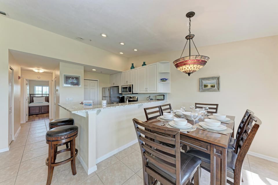 Your open-concept kitchen and dining area features granite counters, modern appliances, and elegant seating for memorable meals together.