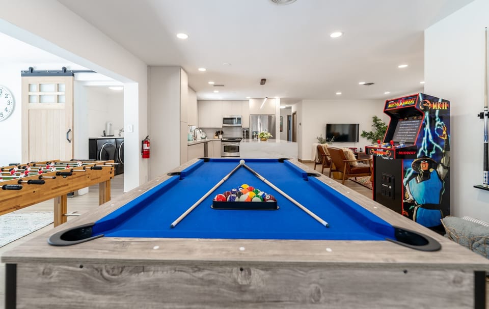Challenge your crew to endless fun with our foosball and pool tables! Perfect for friendly competitions, rainy-day laughs, and quality time together. Create lasting family memories in a home designed for play, connection, and unforgettable vacations.