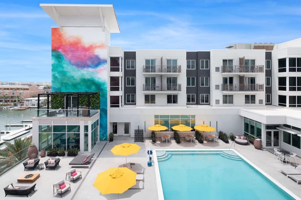 Dive into waterfront serenity with loungers and sunset views.