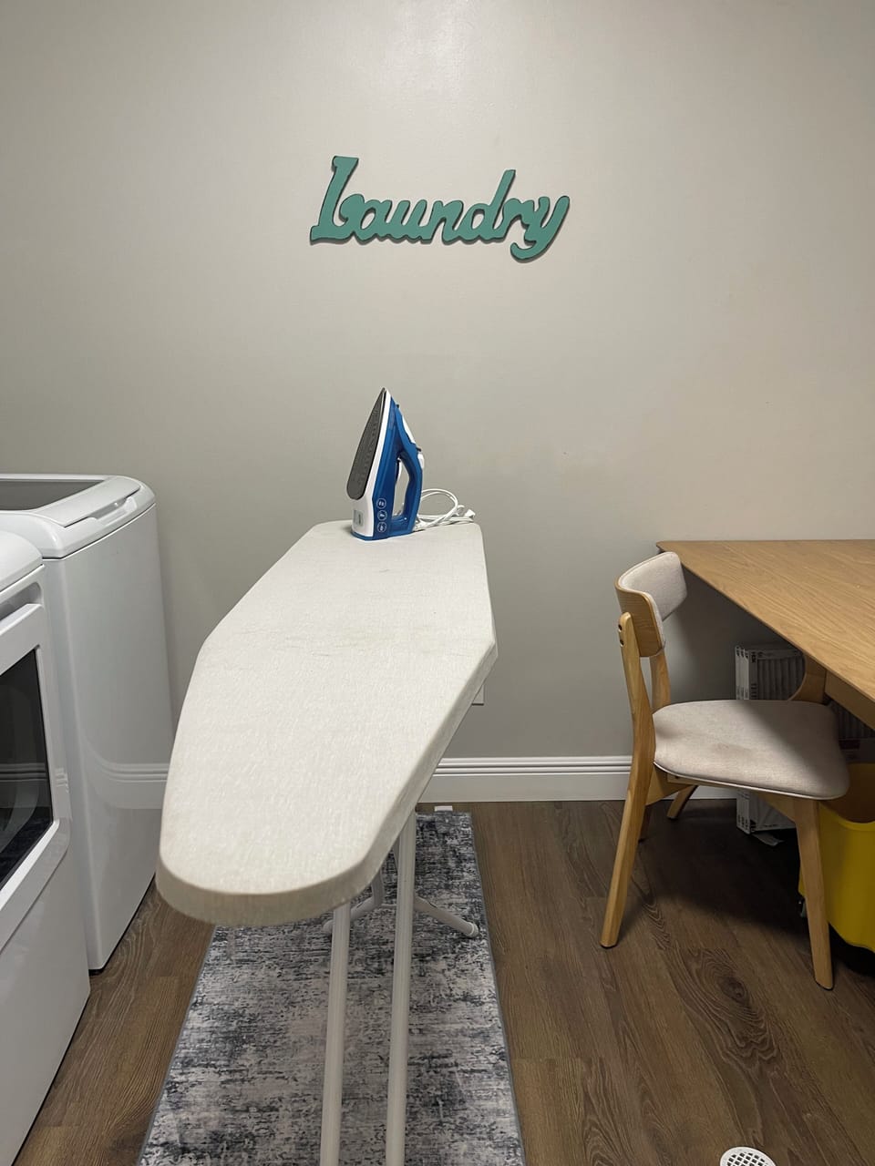 Washer and dryer with ironing board and a few wash pods to get you started.