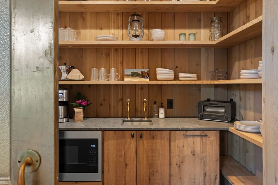 Butler's pantry and coffee bar for all your group's needs.