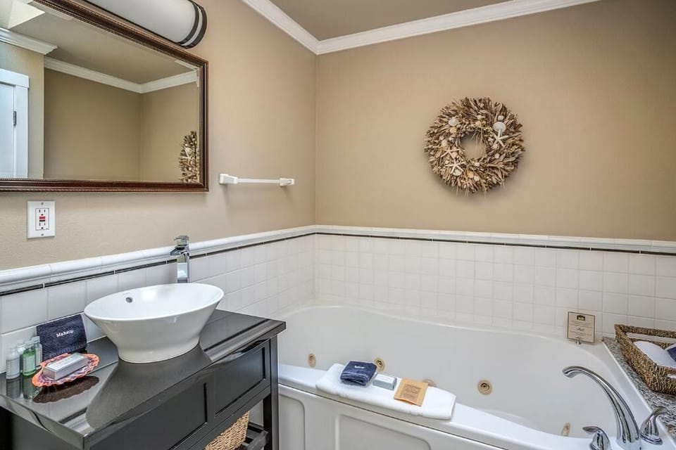 Refresh in a spotless bath with soaking tub and plush towels.