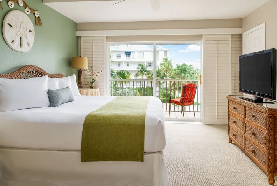 Wake up to palm views from your serene king suite.