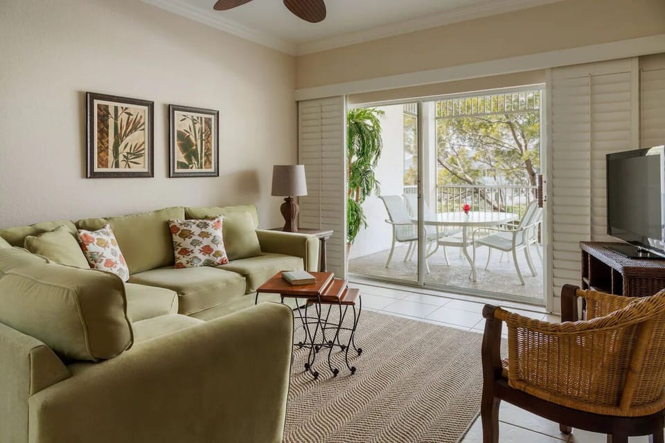 Unwind on the comfy sofa, steps from the lanai.