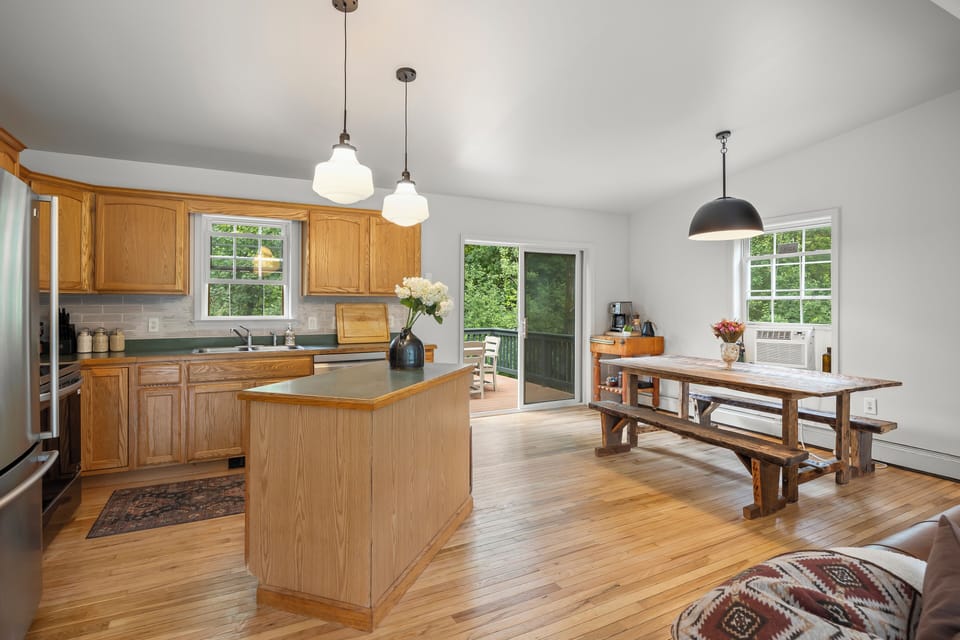 Open-concept kitchen & dining area, perfect for cooking, dining, and gathering.