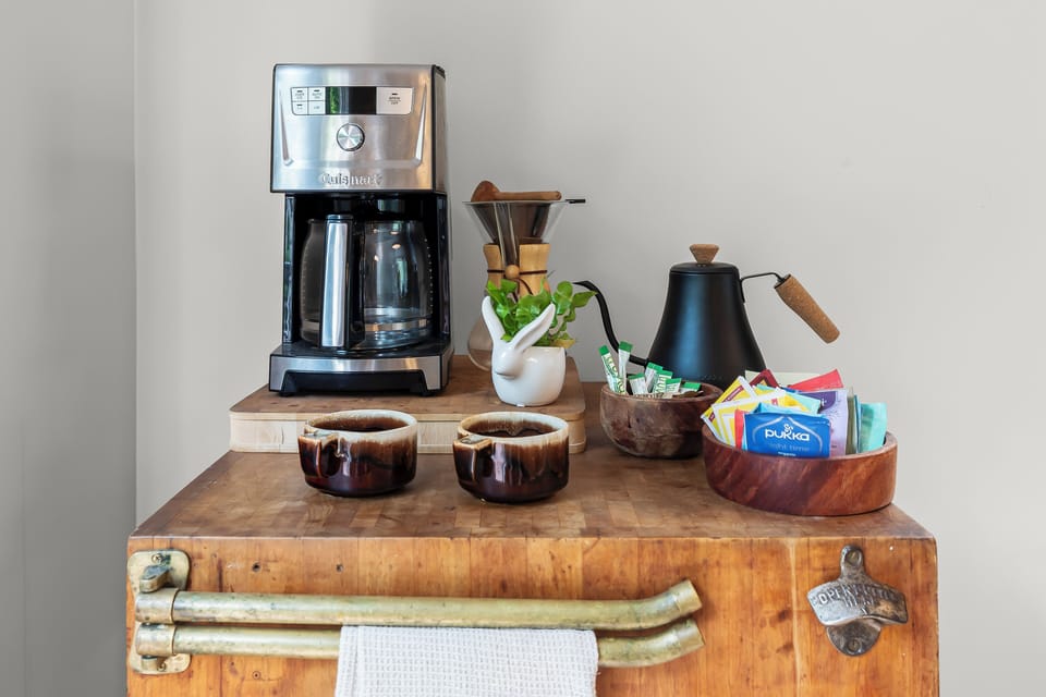 Cozy coffee station filled with a variety of coffee and tea options 