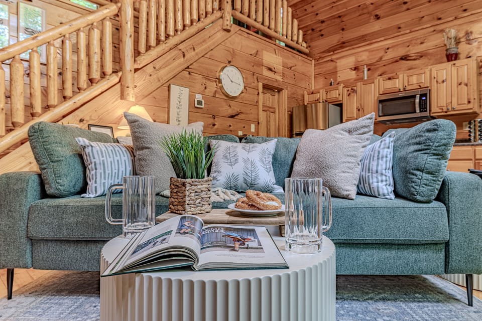 Relax and unwind on the comfortable sofa in the heart of this cozy cabin living area.