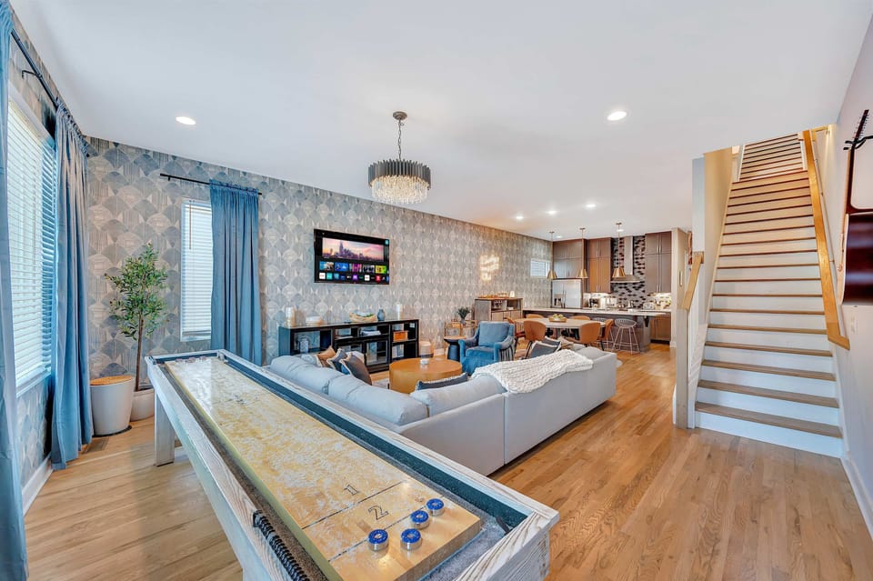 Unwind with friends in this luxurious Nashville rental featuring chic decor, a game room, and spacious accommodations. Ideal for family reunions or bachelorette parties, this elegant retreat guarantees a memorable getaway in Music City!