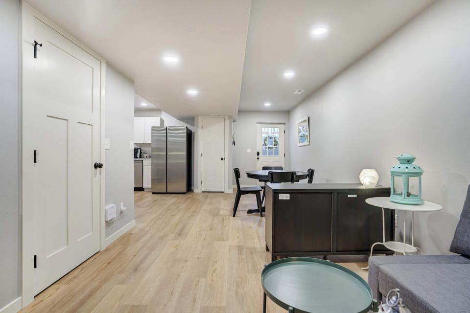 The open-concept layout offers a seamless flow from the living area to the kitchen and dining space, making it easy to gather, dine, and unwind together in comfort.







