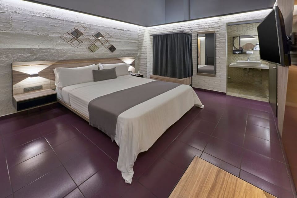 Relax in a spacious, contemporary room with warm ambient glow.