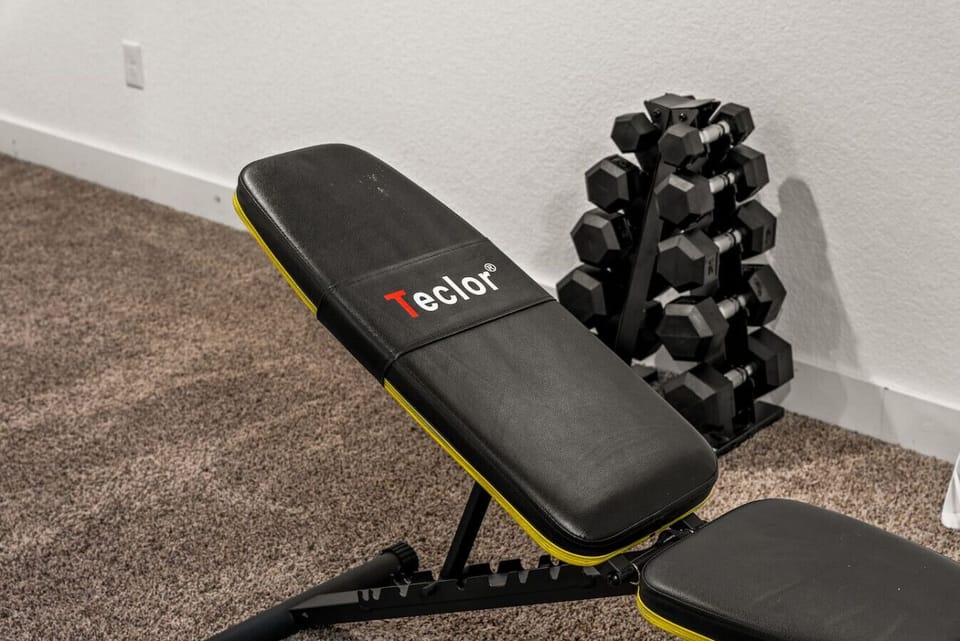Lower level game room with ping pong, board games, and exorcise equipment