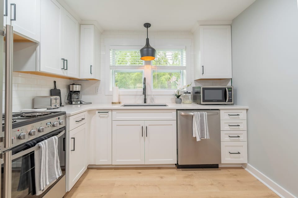 Fully equipped kitchen with sleek appliances and all the essentials ready for your stay.