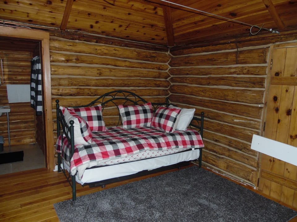 INTERIOR:  A picture of the bed.  (Will be getting replaced with a queen-size bed.)