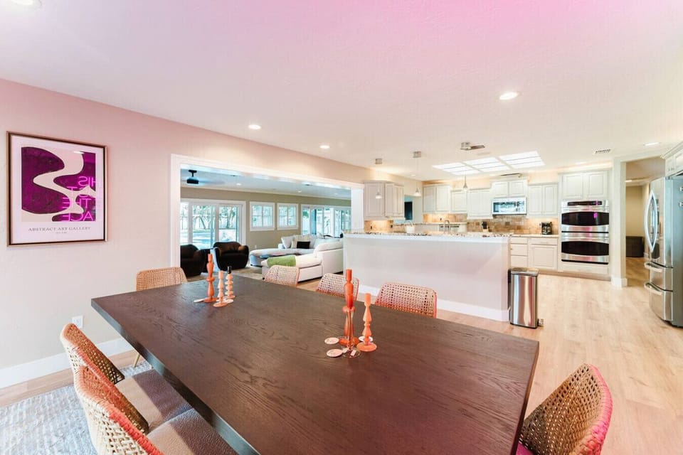 Spacious open-concept living at Indian Shores Escape! Enjoy a stylish dining area, a fully equipped modern kitchen, and a cozy lounge space—all bathed in natural light for the perfect Florida getaway.