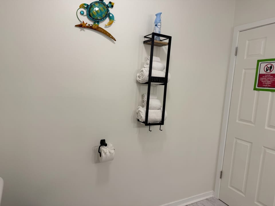 Main bathroom located in the hallway, featuring a shower only.