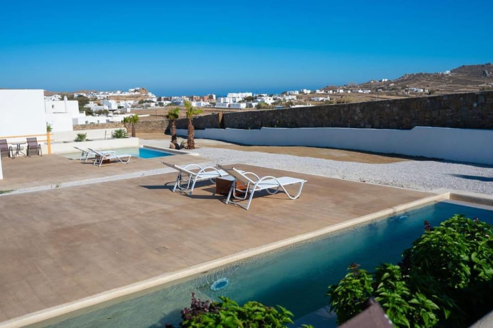 Spacious Outdoor Patio with Sea Views – Ample seating and dining area ideal for relaxing under the Cretan sky.