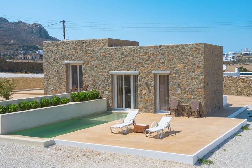 Traditional Mykonian Stone Architecture – Timeless Cycladic-inspired design blending natural stone with elegant modern lines.