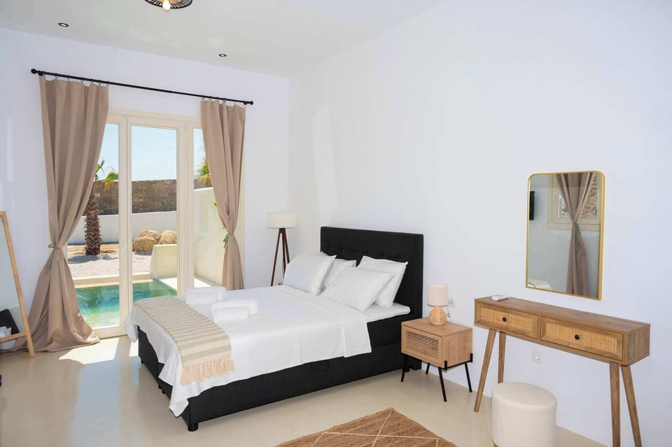 Comfortable double bed with neutral tones and handcrafted accents.