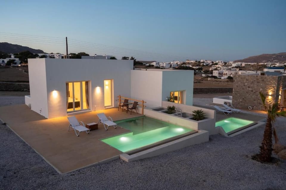 The private pool area illuminated for relaxing nights under the stars.