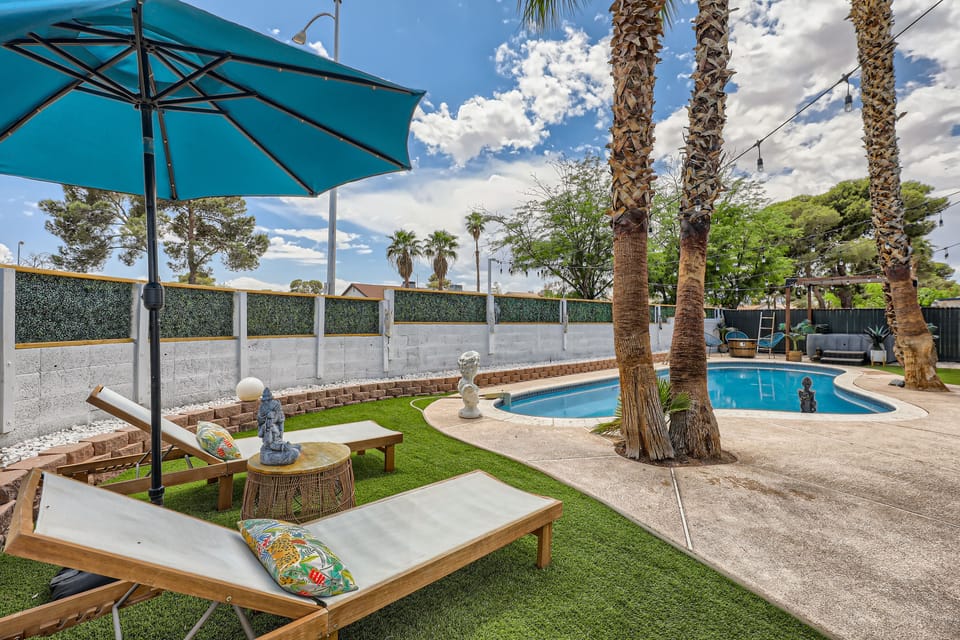 Bask in comfort with poolside seating and nature.

