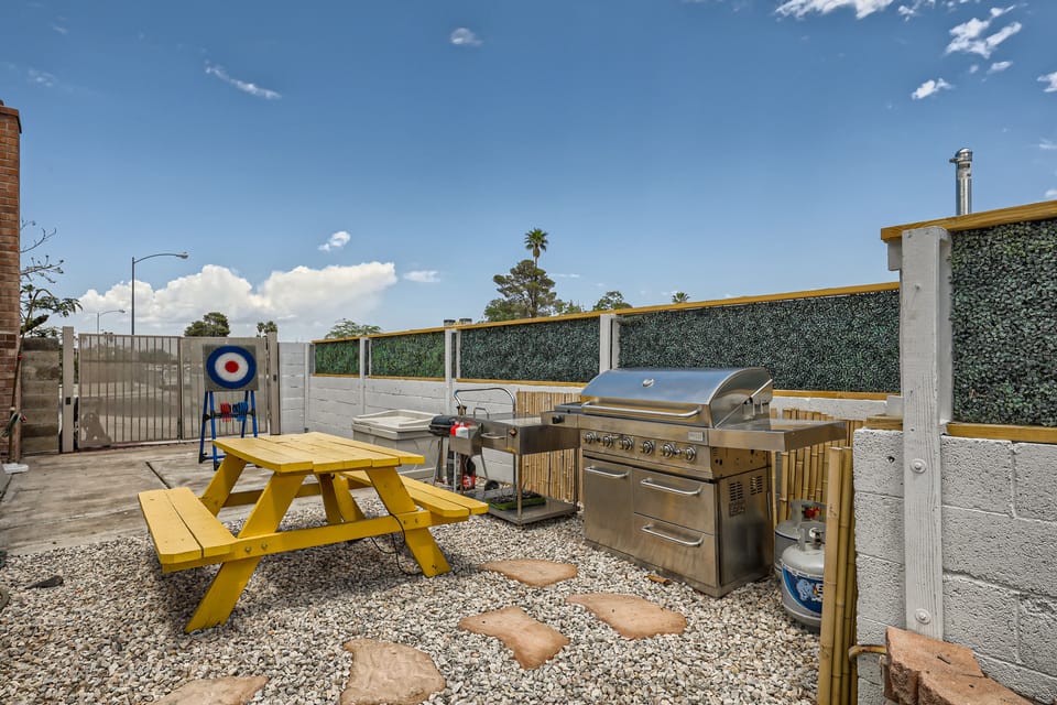 Grill and dine outdoors in this sunny, spacious backyard.

