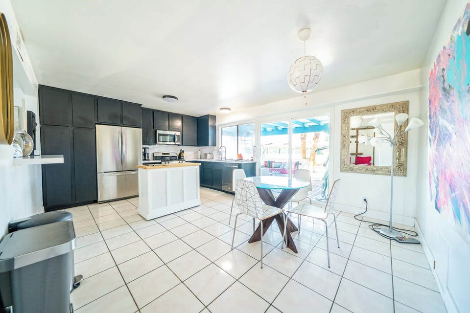 Large, open kitchen with dining for six and pool views

