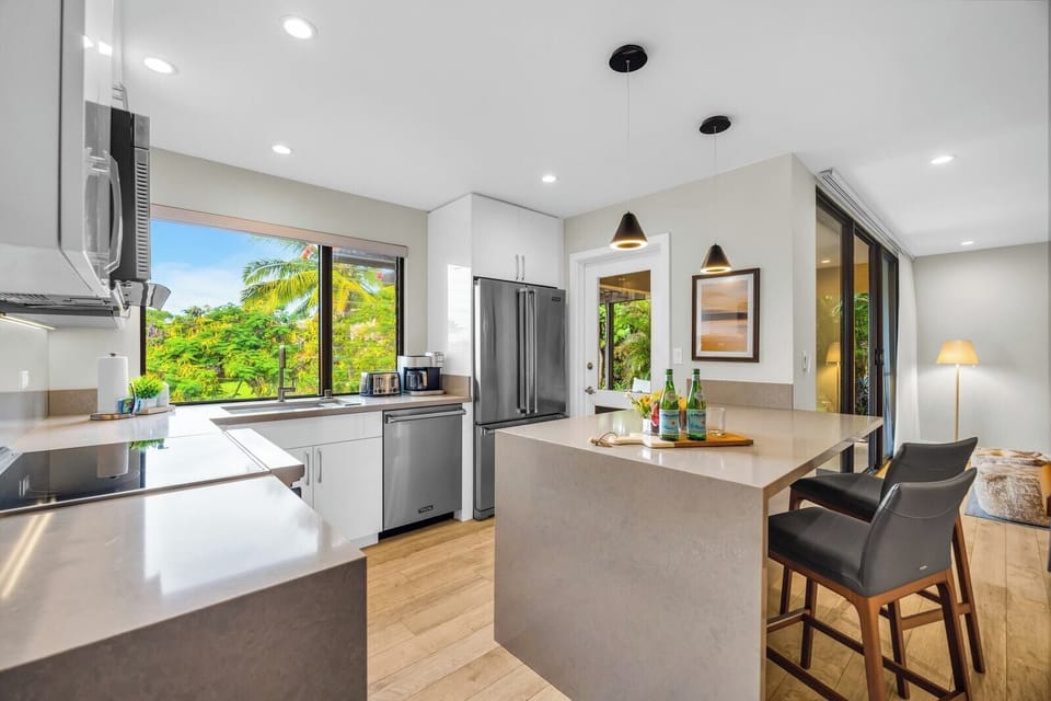 Open concept kitchen that flows effortlessly into island living