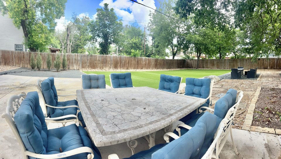 BBQ sitting area shaded by great red oak tree