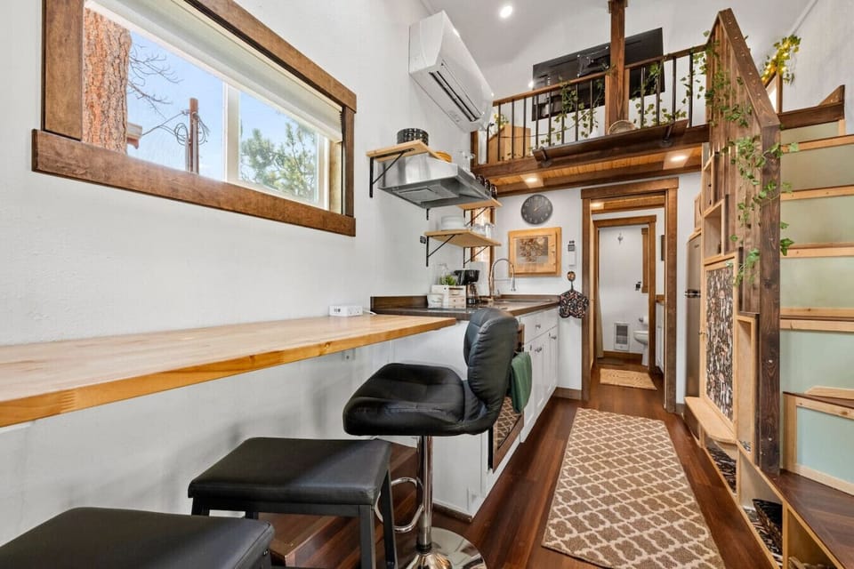 Modern design meets functional elegance with a sleek bar and scenic views!