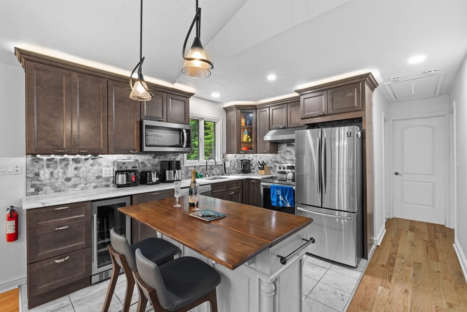 Cook with ease in this modern kitchen—includes full appliances and island counter