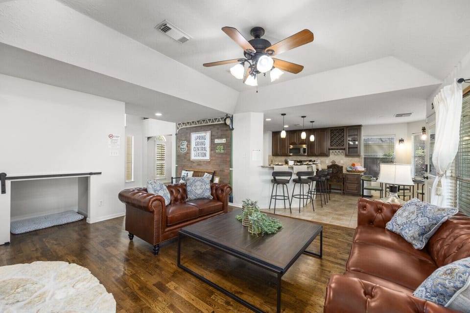 Open-concept living space connects seamlessly to the kitchen and dining areas, creating an easy flow for group gatherings.