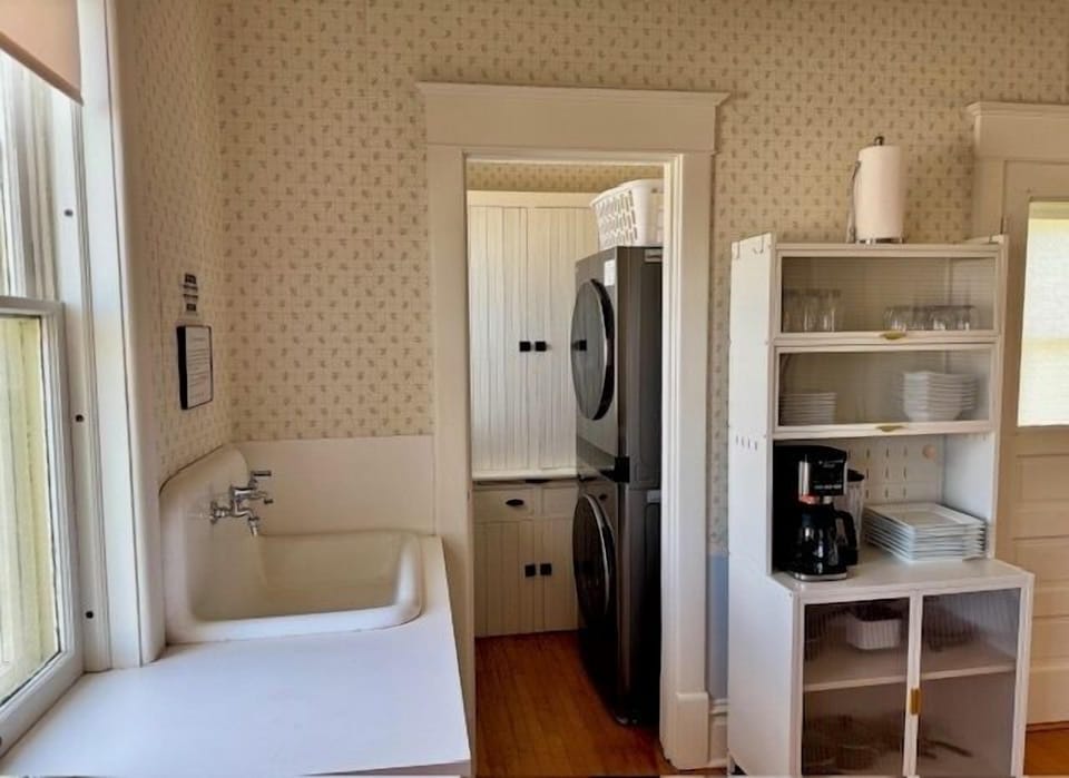 Kitchen view with full sized washer and dryer