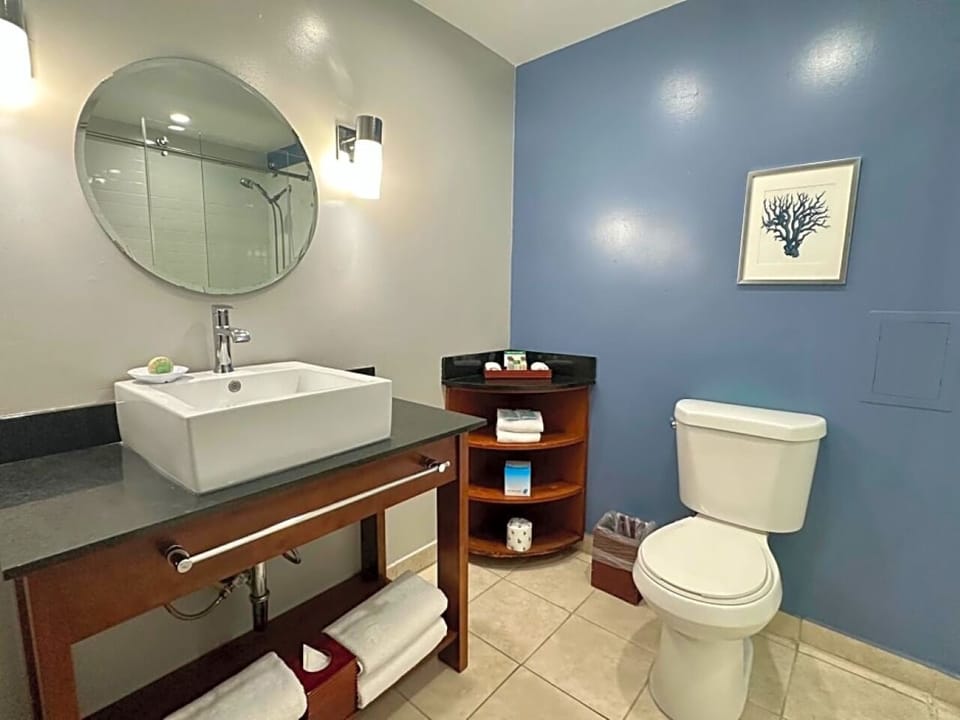 Refresh easily in a modern bath with bright vanity lighting.