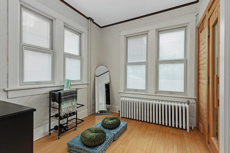 Peaceful Flex Space for Yoga, Reading, or Remote Work. This tranquil and light-filled room offers the perfect multi-purpose space for guests looking to unwind or stay productive during their trip.