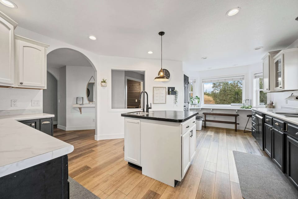 Clean, modern kitchen w/ plenty of counter space to cook