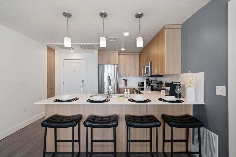 Cook up a storm in our well-appointed kitchen, featuring an induction stove, oven, and plenty of seating at the island.