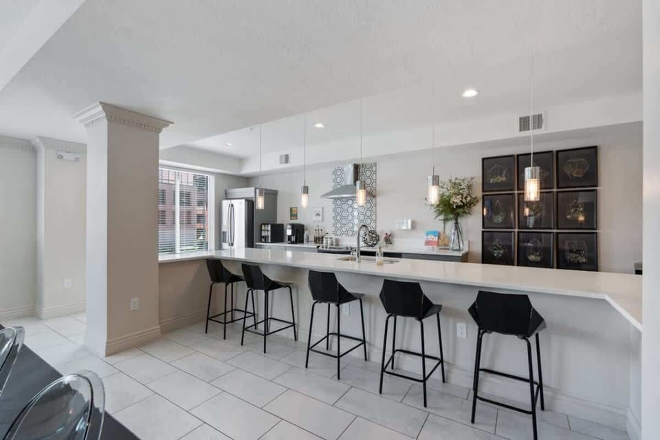 Cook and relax in style with our fully-equipped kitchen, featuring an induction stove and a cozy kitchen island.