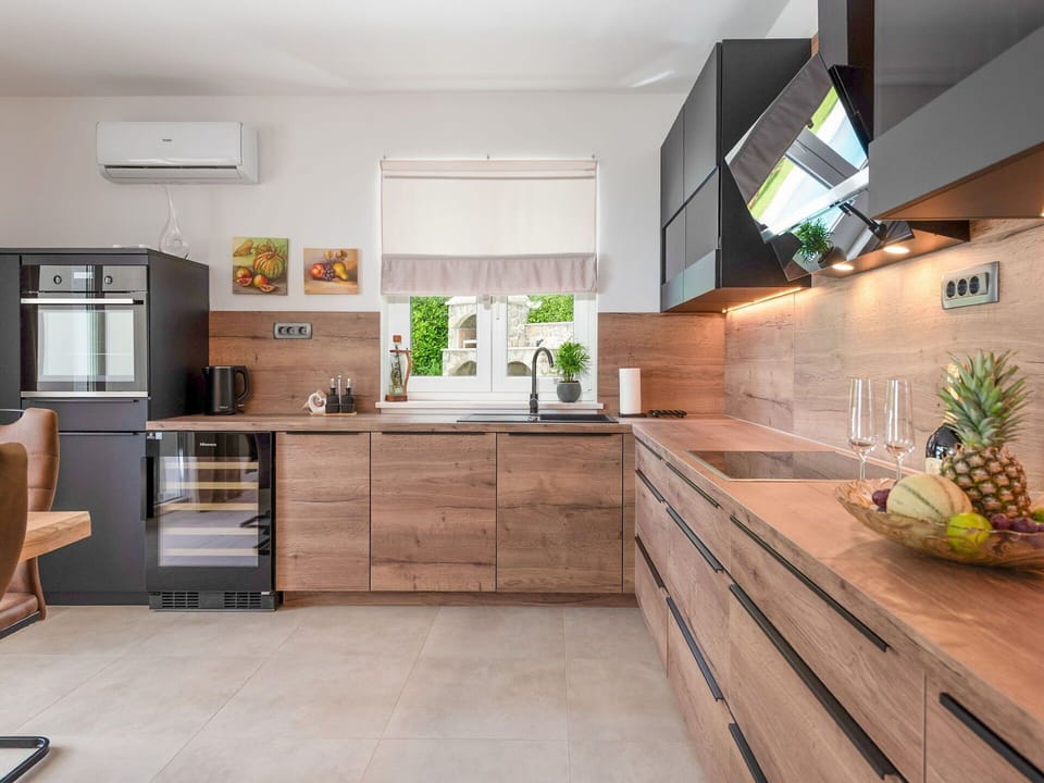 Furniture, Kitchen, Flooring, Kitchen Appliance, Interior Design, Wood, Cabinetry, Countertop, Floor, Major Appliance