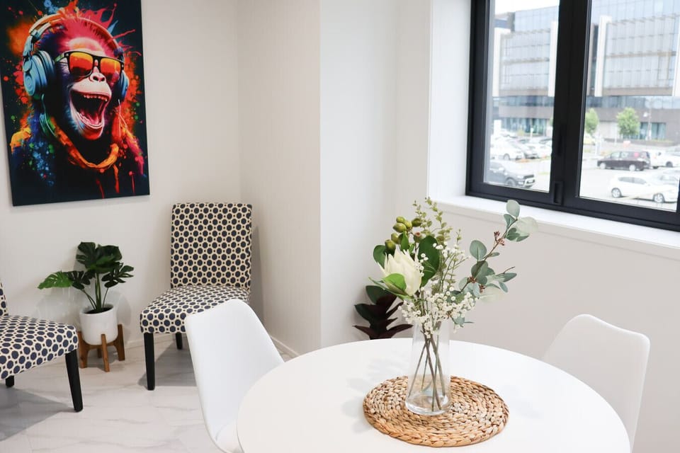 Bright dining area with a table and comfortable seating, perfect for enjoying meals or gathering with friends.