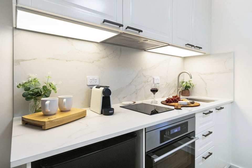Kitchenette | Prepare simple meals and morning coffee with modern appliances and generous bench space.