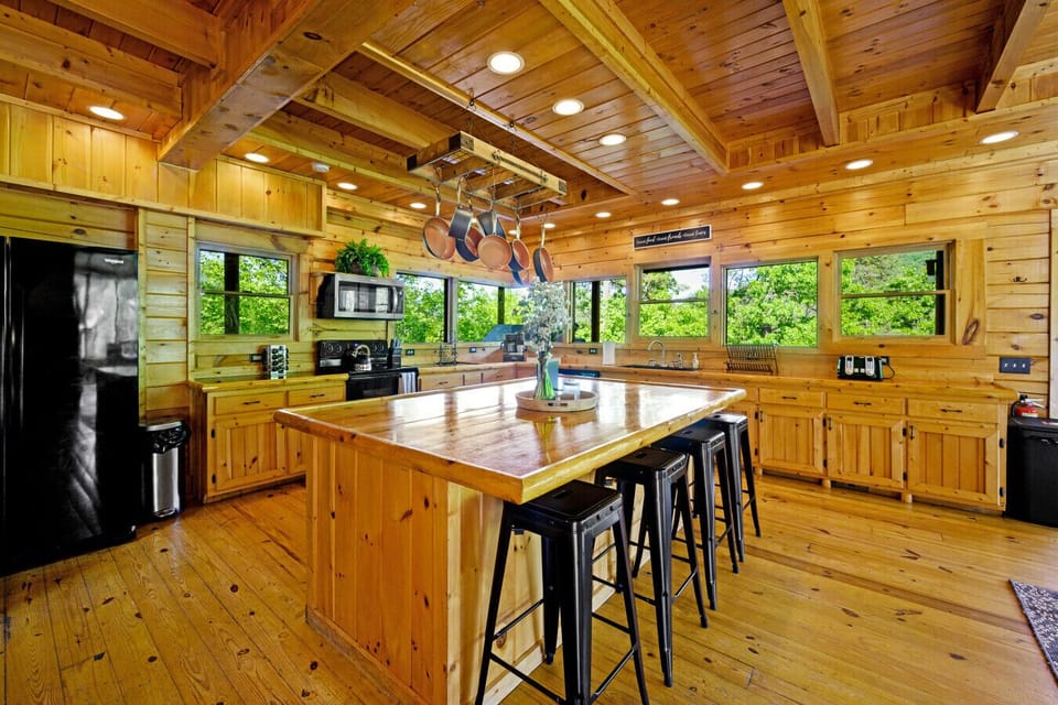 Fully Stocked kitchen and spacious island with additional seating