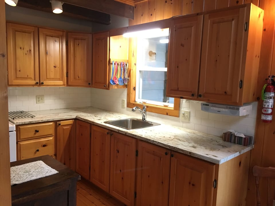 Kitchen -full size refrigerator and freezer. 30" range -ceramic stovetop