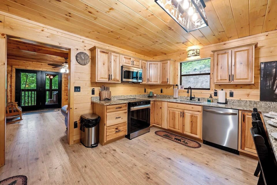  Kitchen Bliss: Enjoy culinary adventures in a bright, modern kitchen with stunning wood accents!