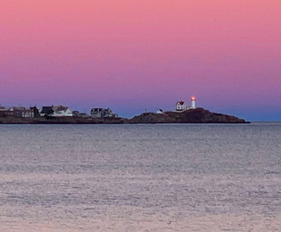 Nubble Lighthouse sunset from the beach across from Sea Spray Cottages