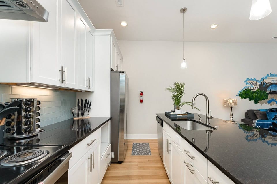 Middle floor kitchen, fully stocked with pots, pan, seasonings, and coffee.