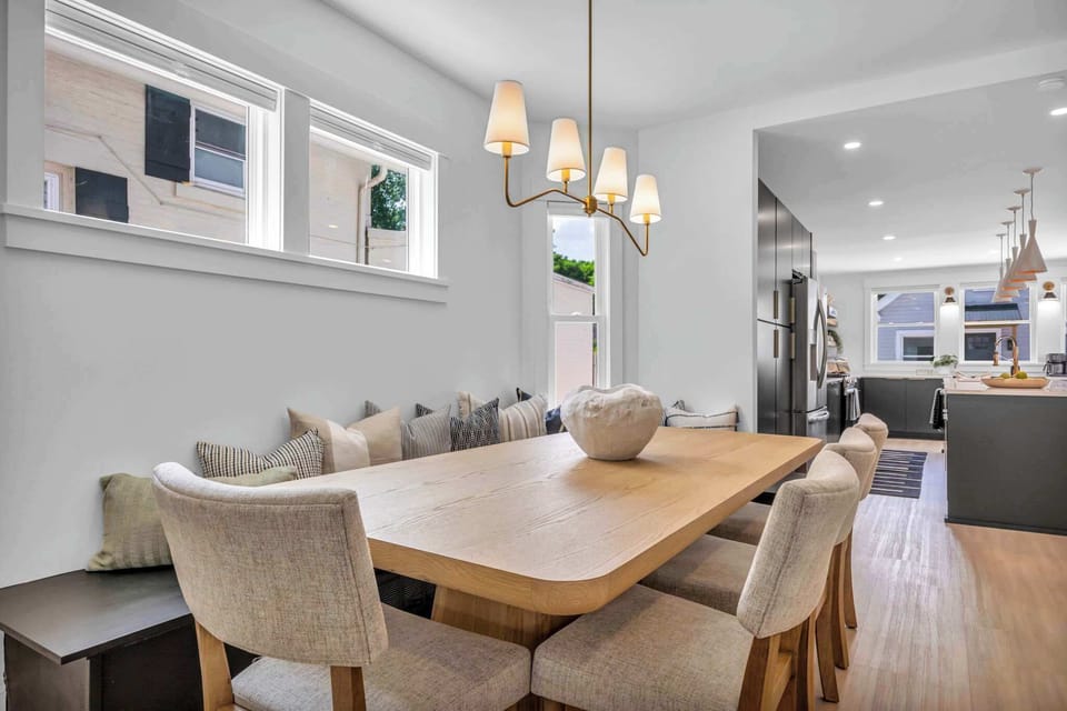 Bask in natural light pouring through oversized windows as you dine or relax. This bright, stylish space is perfect for cozy breakfasts, lively dinners, and everything in between.
