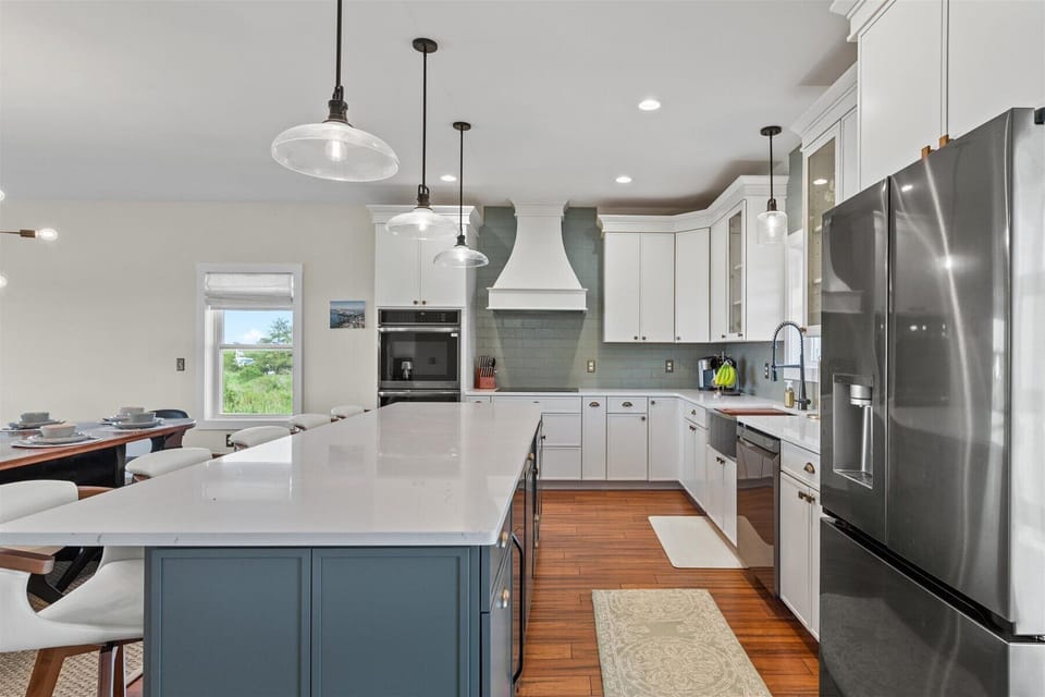 Beachy White and Sea Grass Green Cabinetry and tons of space.