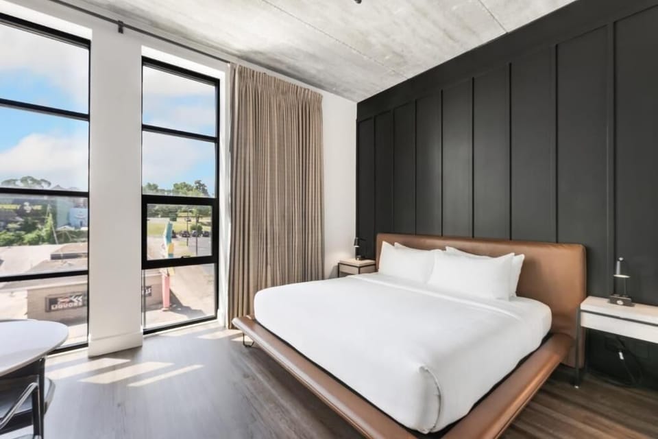 Stretch out on the plush platform bed under lofty ceilings.