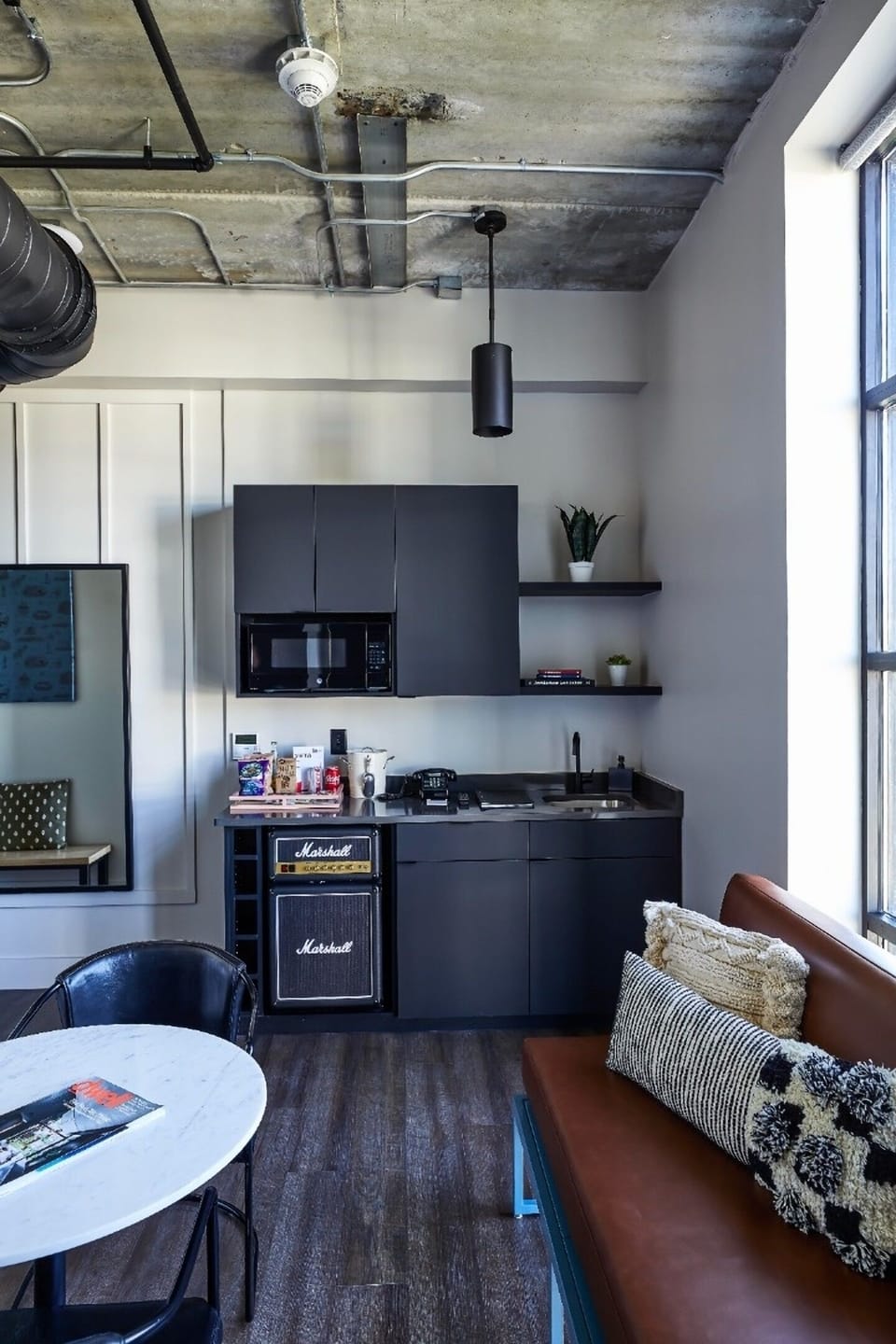 Whip up quick bites with kitchenette essentials and easy seating.