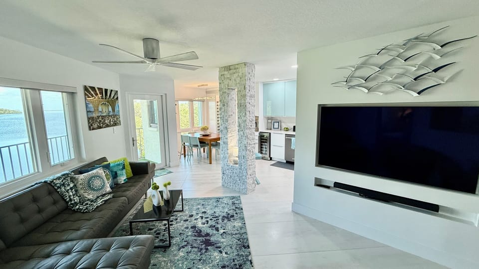 Open-concept living room, dining and kitchen